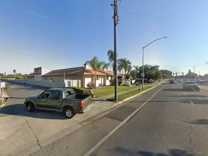 Street level view of the address for Omni Family Health in Fresno